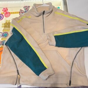 FP Movement arena pullover with forest green and neon yellow accents